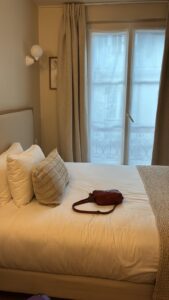A room at Hôtel Basss, Montmartre, with French windows onto a wrought-iron balcony